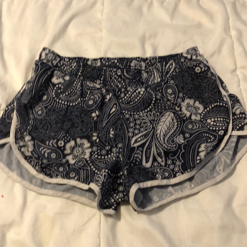 Navy blue and white athletic shorts. Size small.